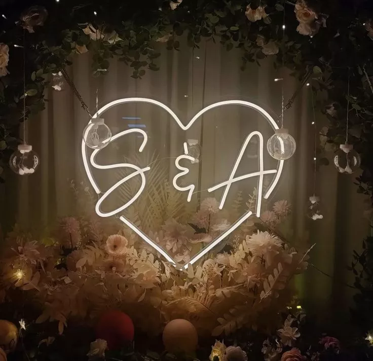 Customised initial heart-shaped neon wedding sign